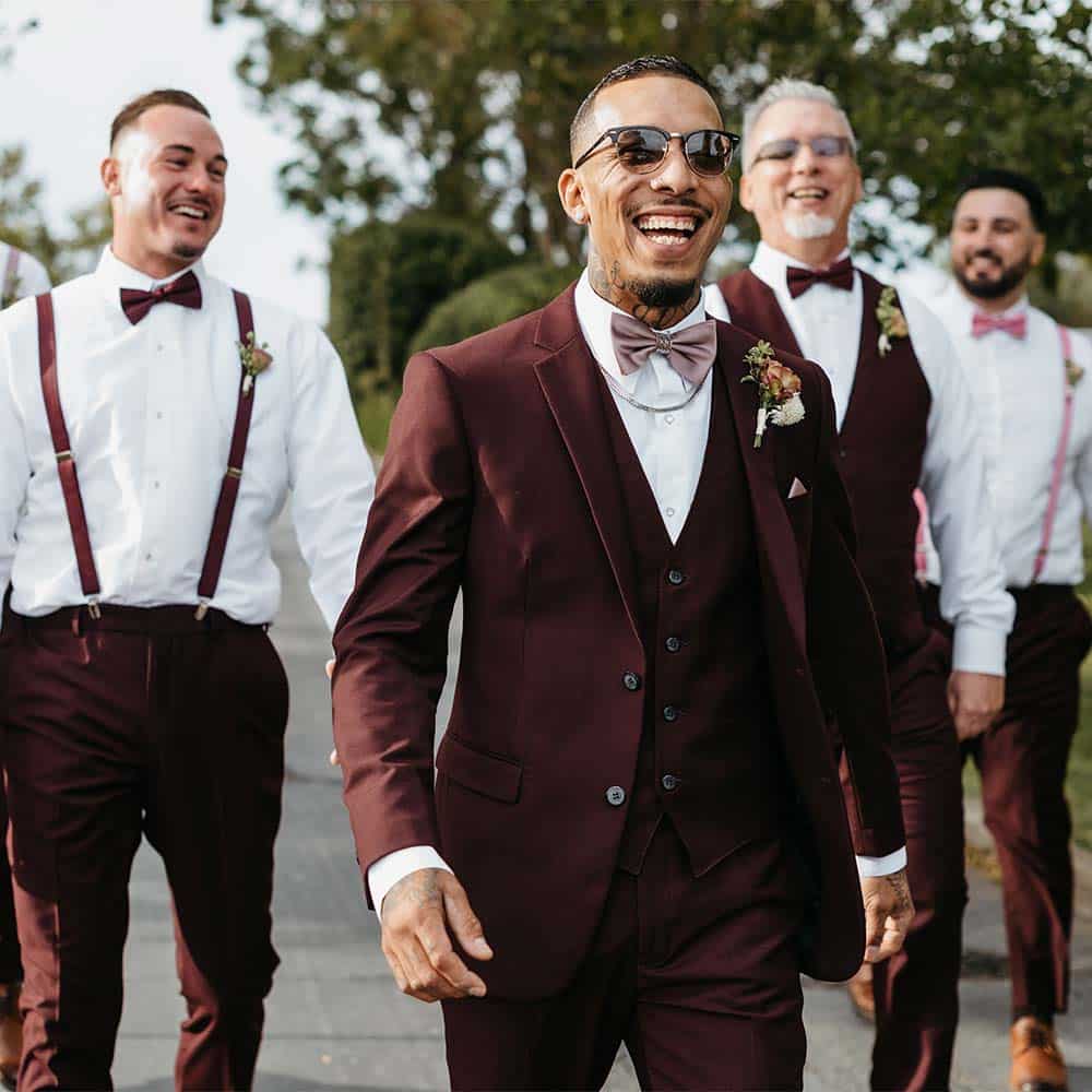 A happy groom and his groomsmen walking to the winery to meet his bride at their Sacramento Delta winery wedding.